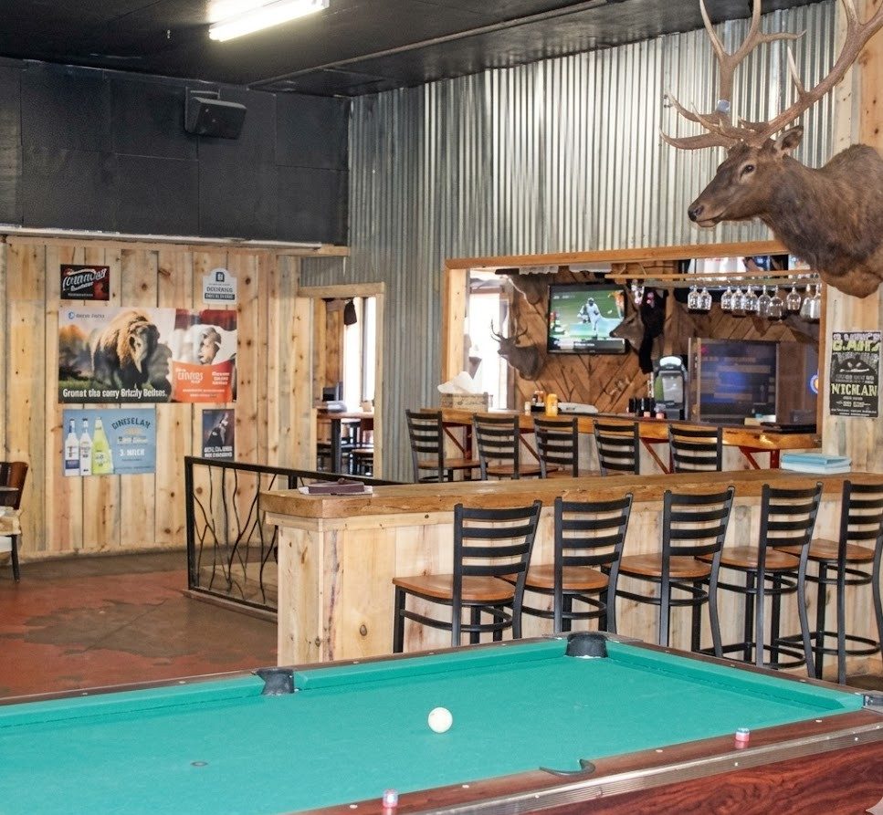 Pool table and bar inside Blondie's